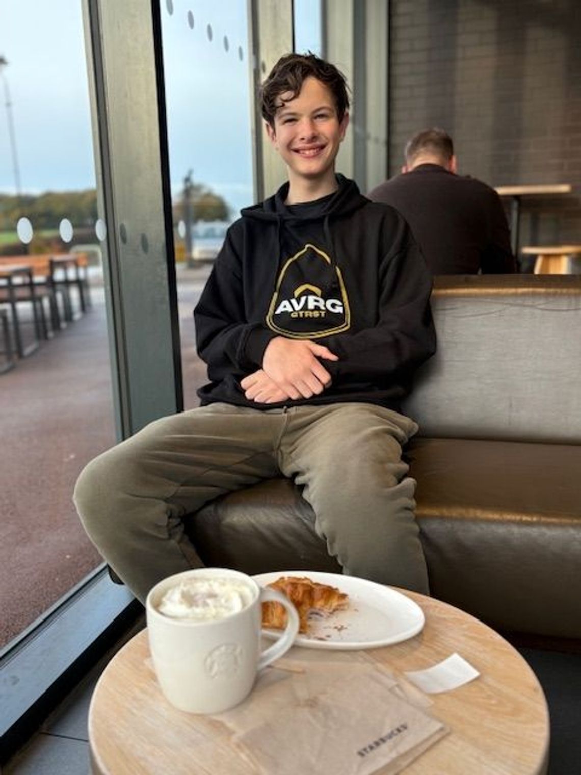 budding guitarist Jack Williams wearing an ABove Average GTRST (guitarist) hoodie made from sustainable 100% organic cotton